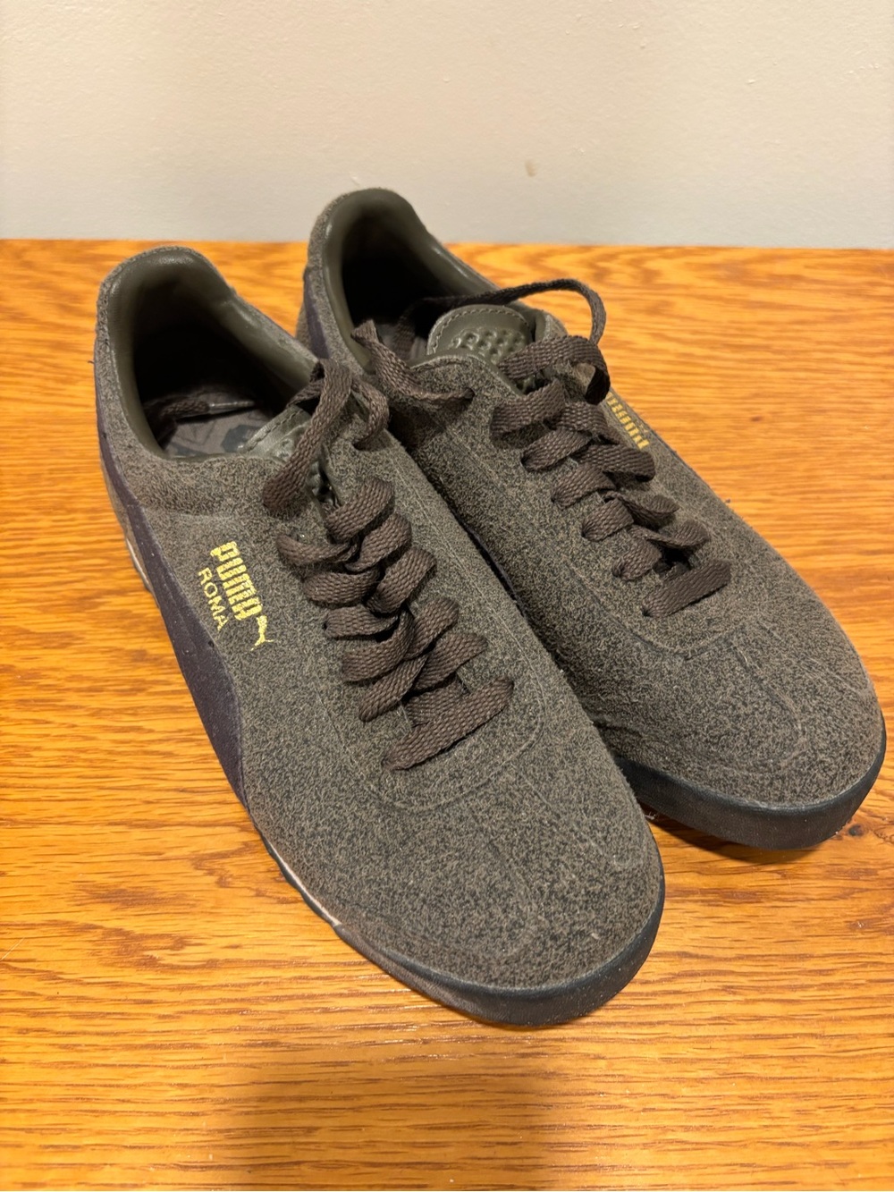 Puma Women’s Sneakers in Dark Brown with Gold Logo